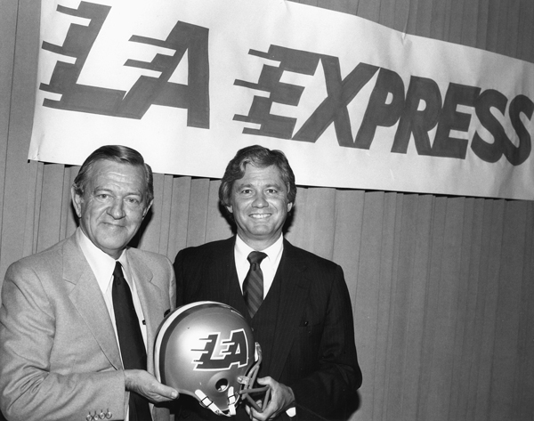 Bill Daniels holding LA Express football helmet